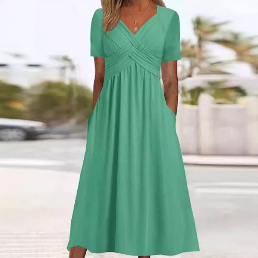 Women's airy midi dress with V-neck, wrap look, empire waist, and pockets StylebySassy