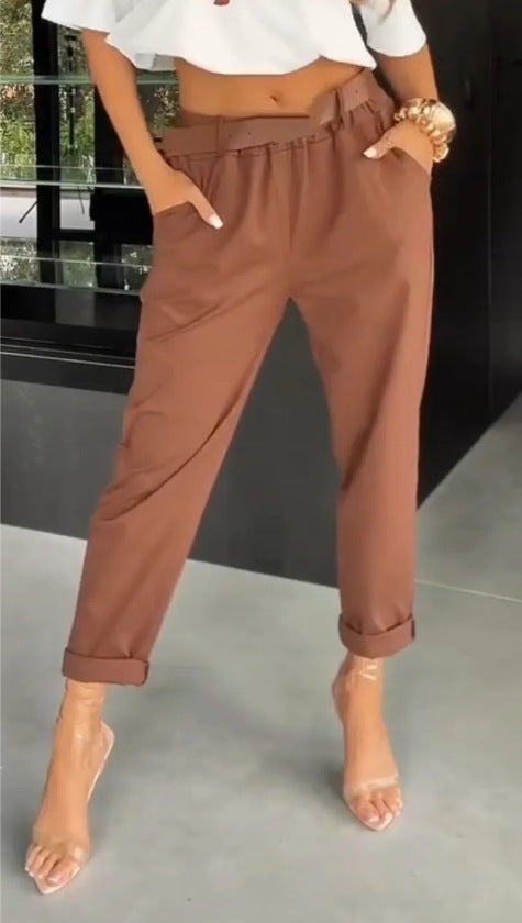 Women's high-waisted paperbag pants with gathered waistband, side pockets, and rolled hem StylebySassy