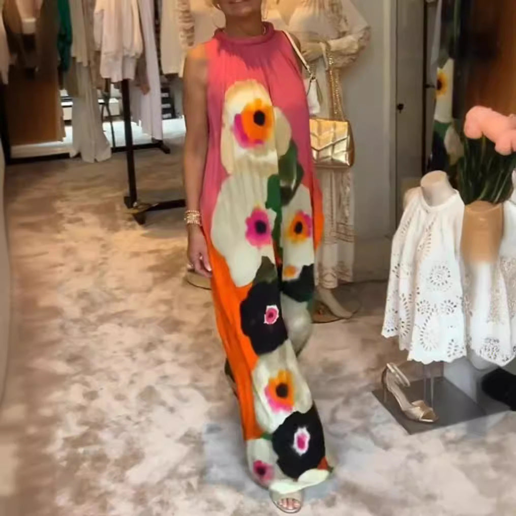 Women's sleeveless maxi dress with ruffled high collar, wide palazzo cut, and large floral print StylebySassy