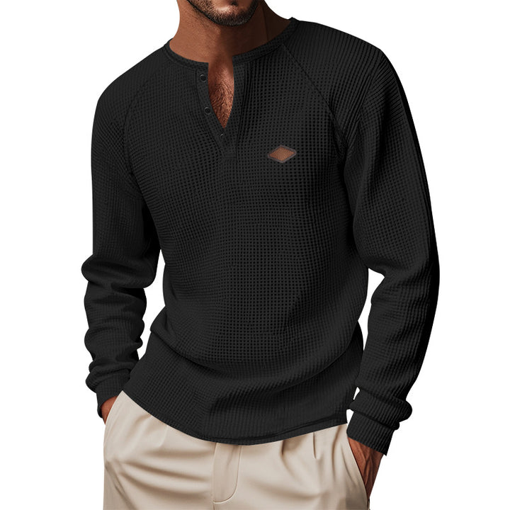 Men's structured long-sleeve shirt with short button placket, raglan sleeves, and subtle logo application StylebySassy