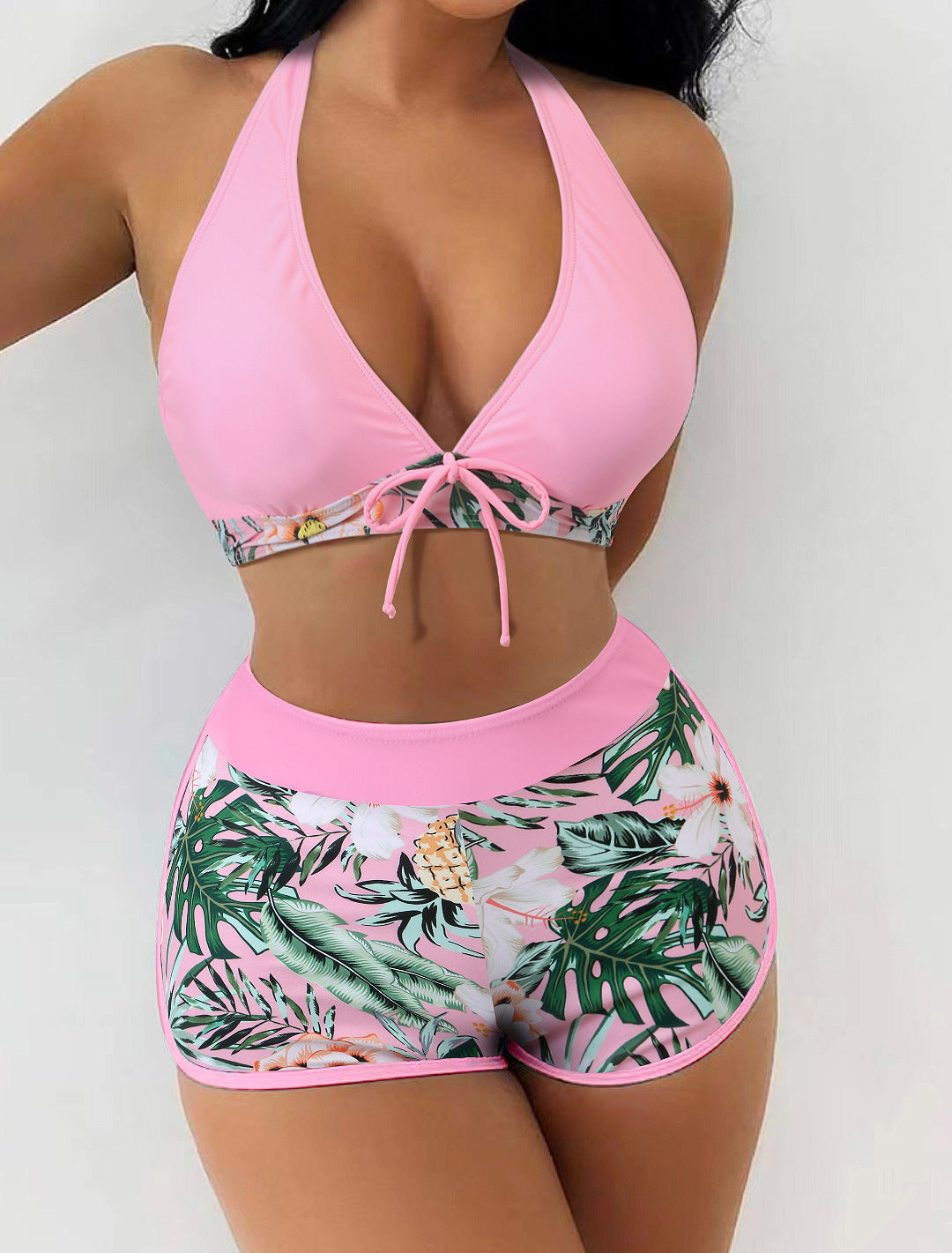 Women's bikini set with sporty high-waist cut and playful floral pattern StylebySassy