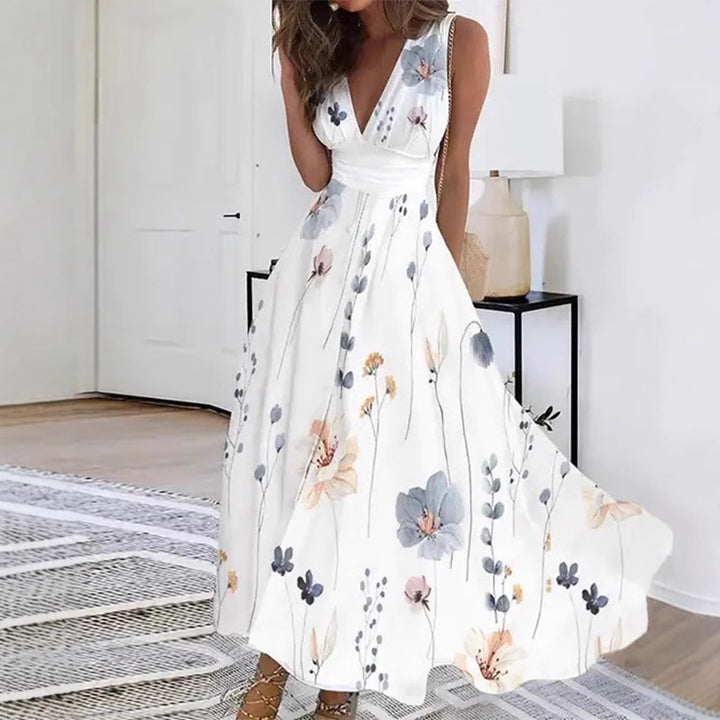 Women's flared midi dress with deep V-neck, empire waist and delicate floral print StylebySassy
