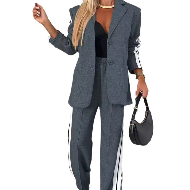 Women's elegant blazer set in sports chic with contrasting side stripes and elasticated waistband trousers StylebySassy
