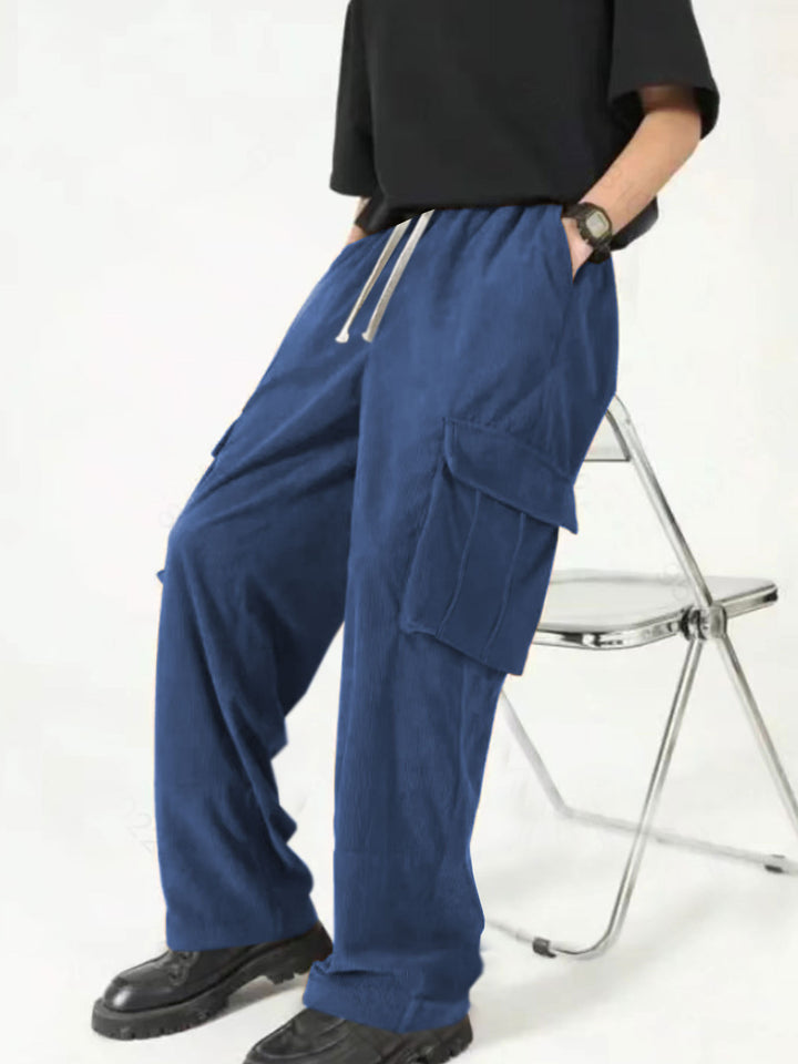 Men's loose wide corduroy cargo pants with drawstring waistband and large flap pockets StylebySassy
