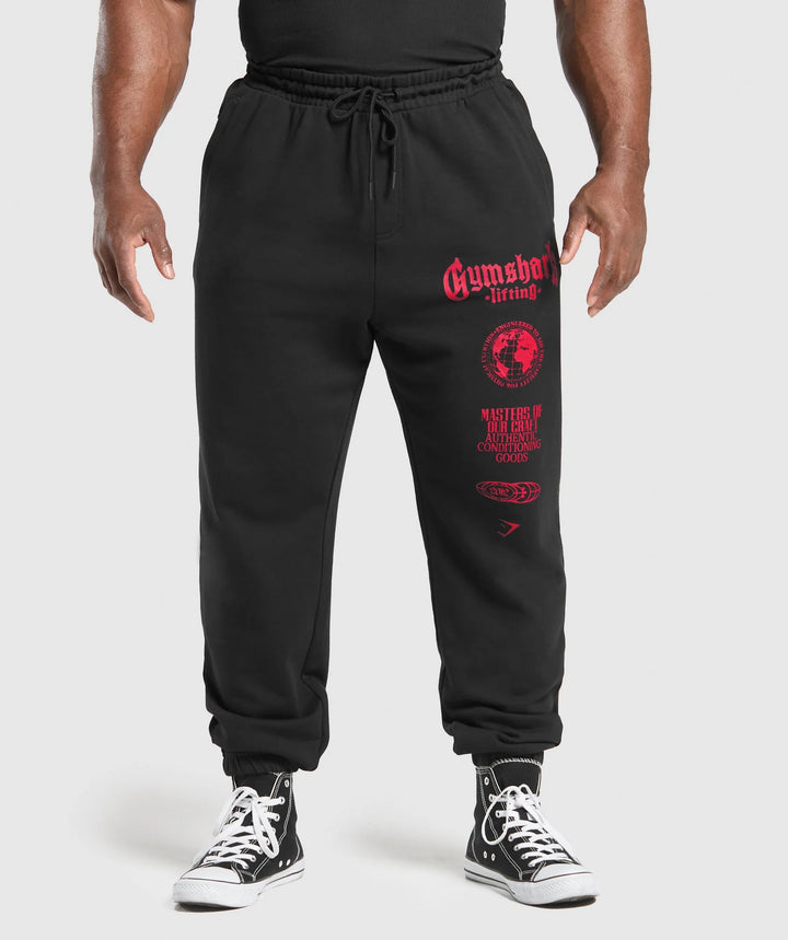 Men's tapered cotton fleece sweatpants with an elastic drawstring waistband, ribbed leg openings, and large logo print StylebySassy