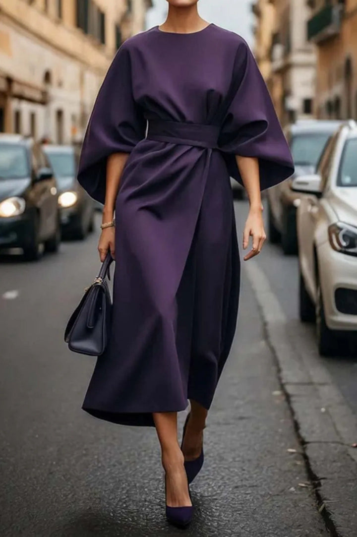 Women's minimalist evening dress with overlong wide sleeves and waist-sculpting pleat draping StylebySassy
