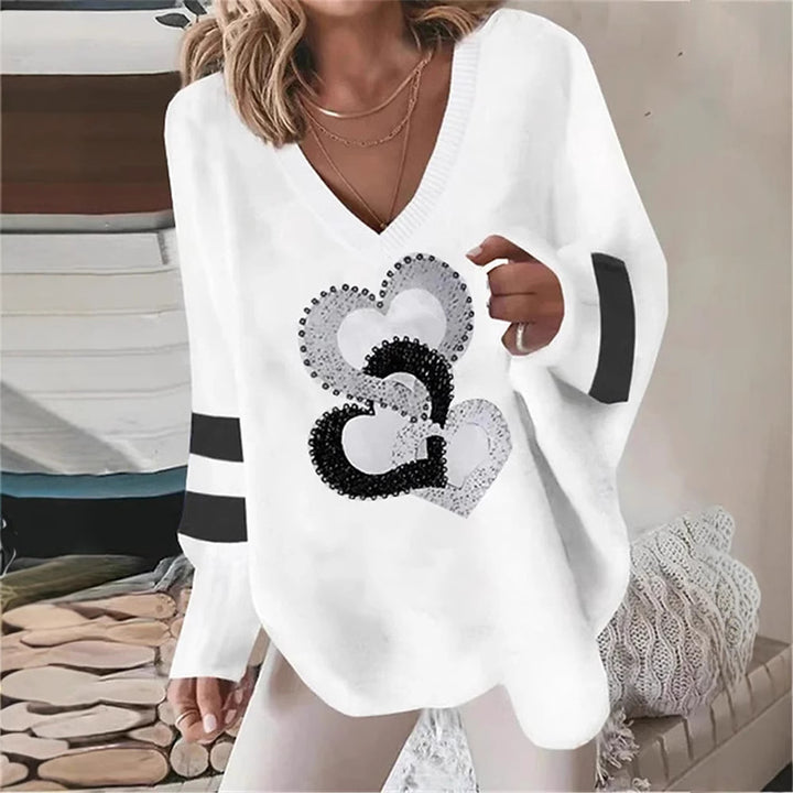 Women's oversized knitted sweater with deep neckline sequin heart and contrast sleeve stripes StylebySassy
