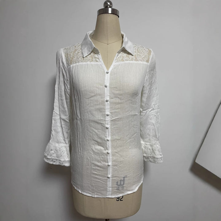 Ladies' semi-transparent crepe blouse with lace yoke, fabric-covered buttons, and three-quarter flounce sleeves StylebySassy