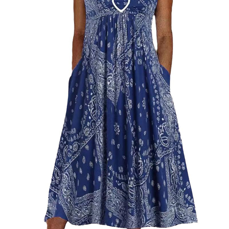 Women's airy maxi dress with paisley bandana print, gathered empire waist and practical side pockets StylebySassy