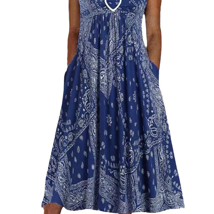 Women's airy maxi dress with paisley bandana print, gathered empire waist and practical side pockets StylebySassy