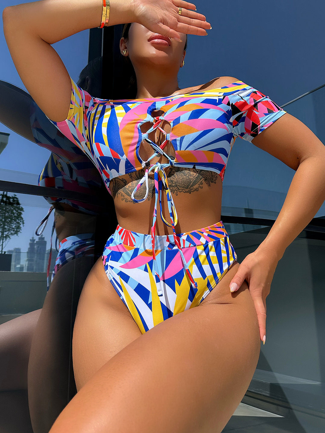 Women's fashionable bikini set with creative cut and colorful geometric design StylebySassy