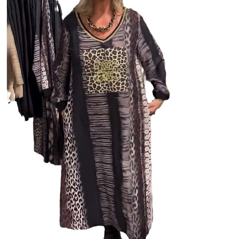 Ladies flowing panel long dress with patchwork animal print and gold-colored chest application StylebySassy