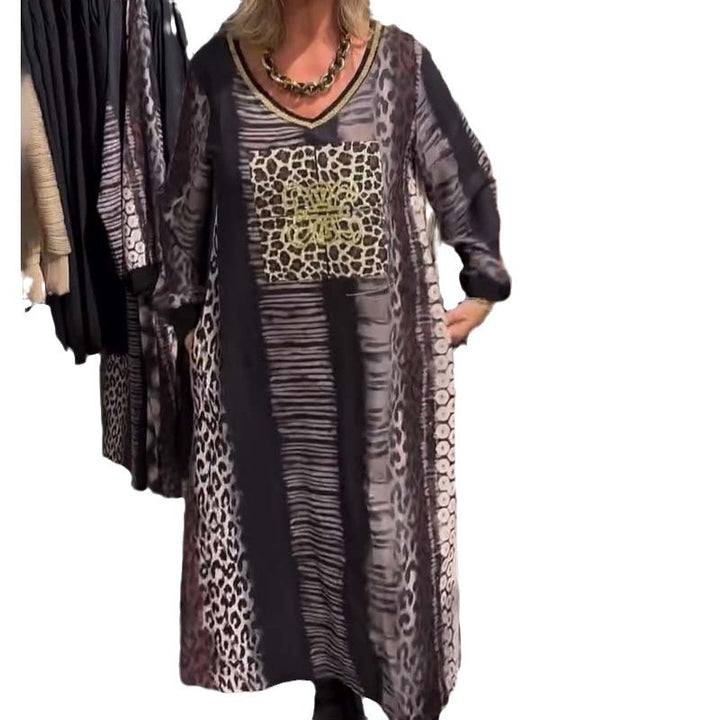 Ladies flowing panel long dress with patchwork animal print and gold-colored chest application StylebySassy