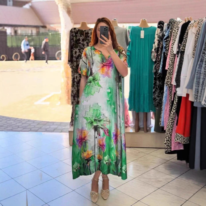 Women flowing maxi kaftan dress with V-neck and large watercolor floral print StylebySassy