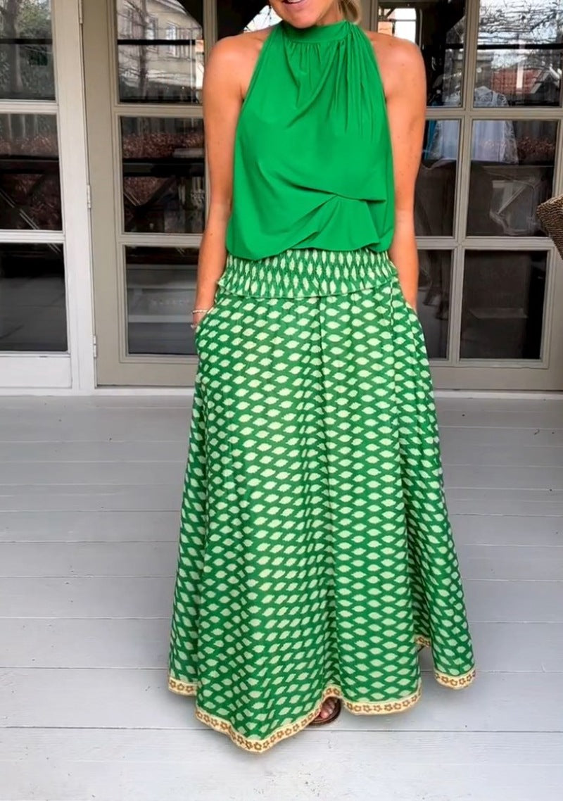 Women's two-piece halter neck set with gathered stand collar and patterned maxi skirt with elastic smocked waistband StylebySassy
