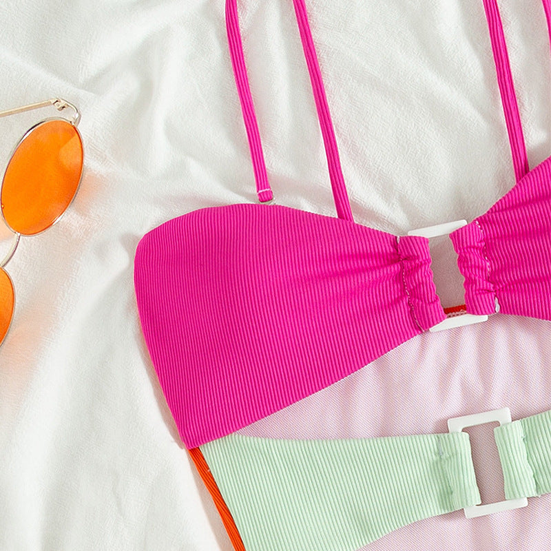 Women's one-piece swimsuit with colorful layered design and buckle StylebySassy