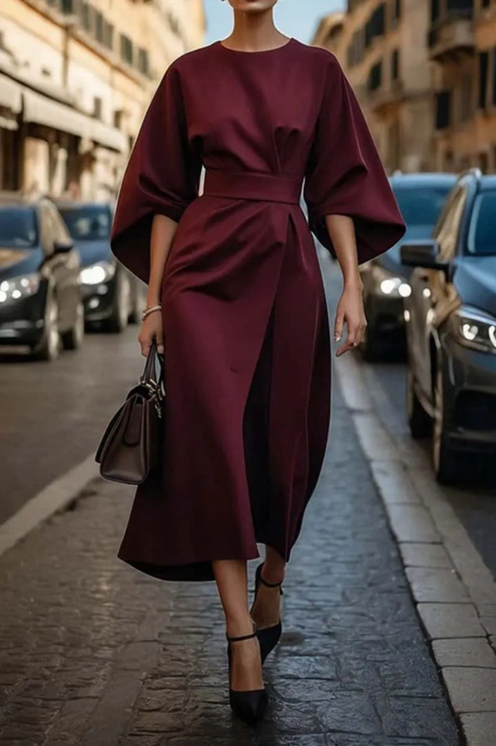 Women's minimalist evening dress with overlong wide sleeves and waist-sculpting pleat draping StylebySassy