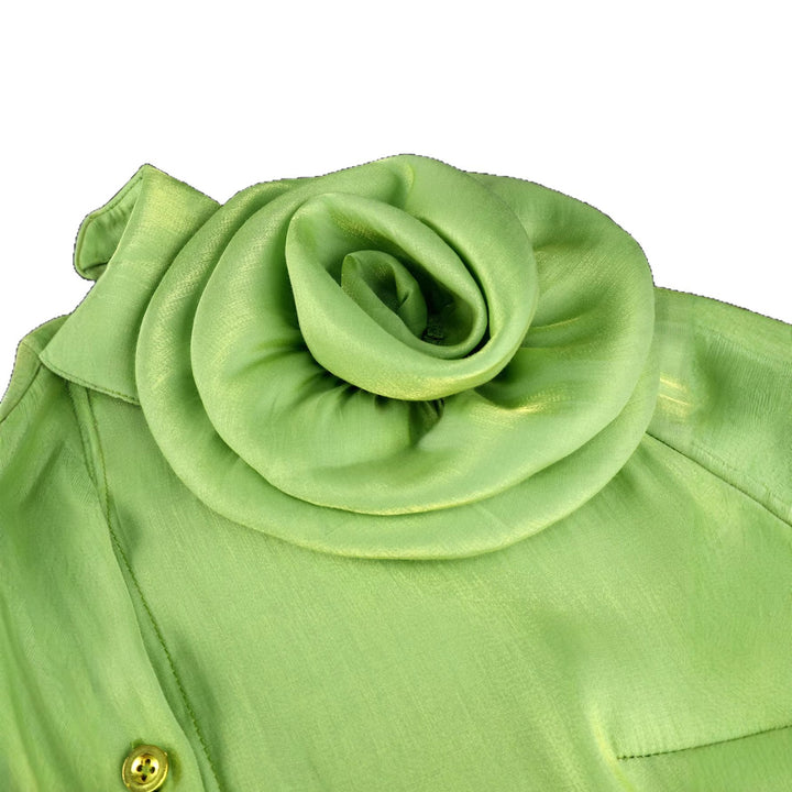 Women’s satin skirt with floral ruffle design and fitted bow detail.