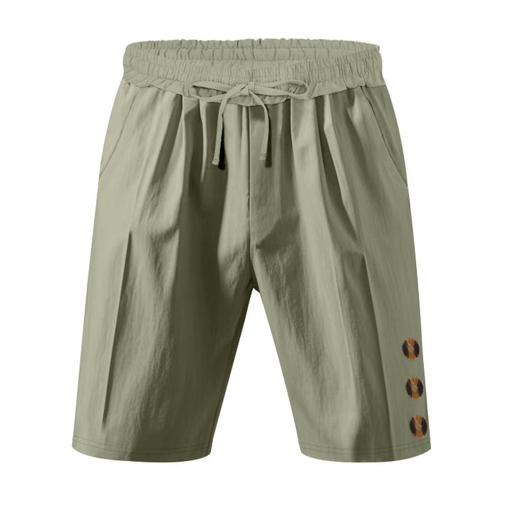 Men's knee-length casual Bermuda shorts with elastic tunnel drawstring waist, side slit pockets, and round decorative appliqués StylebySassy