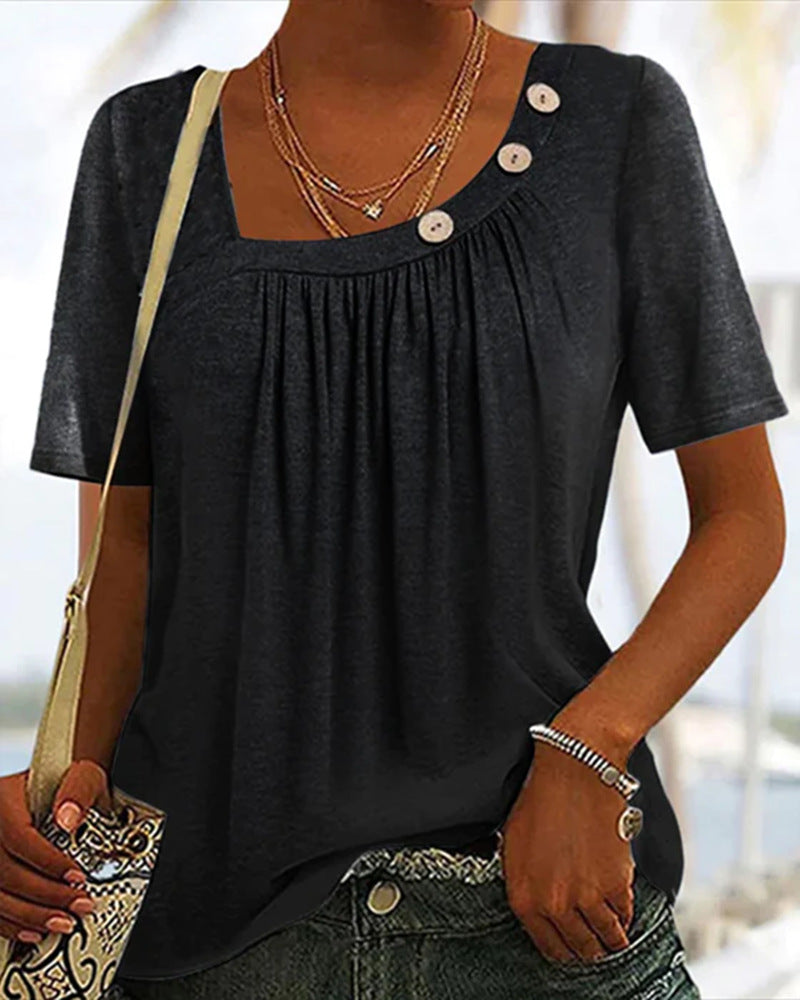Ladies' lightweight short-sleeve tunic with square neckline, fine gathering, and asymmetric decorative buttons StylebySassy