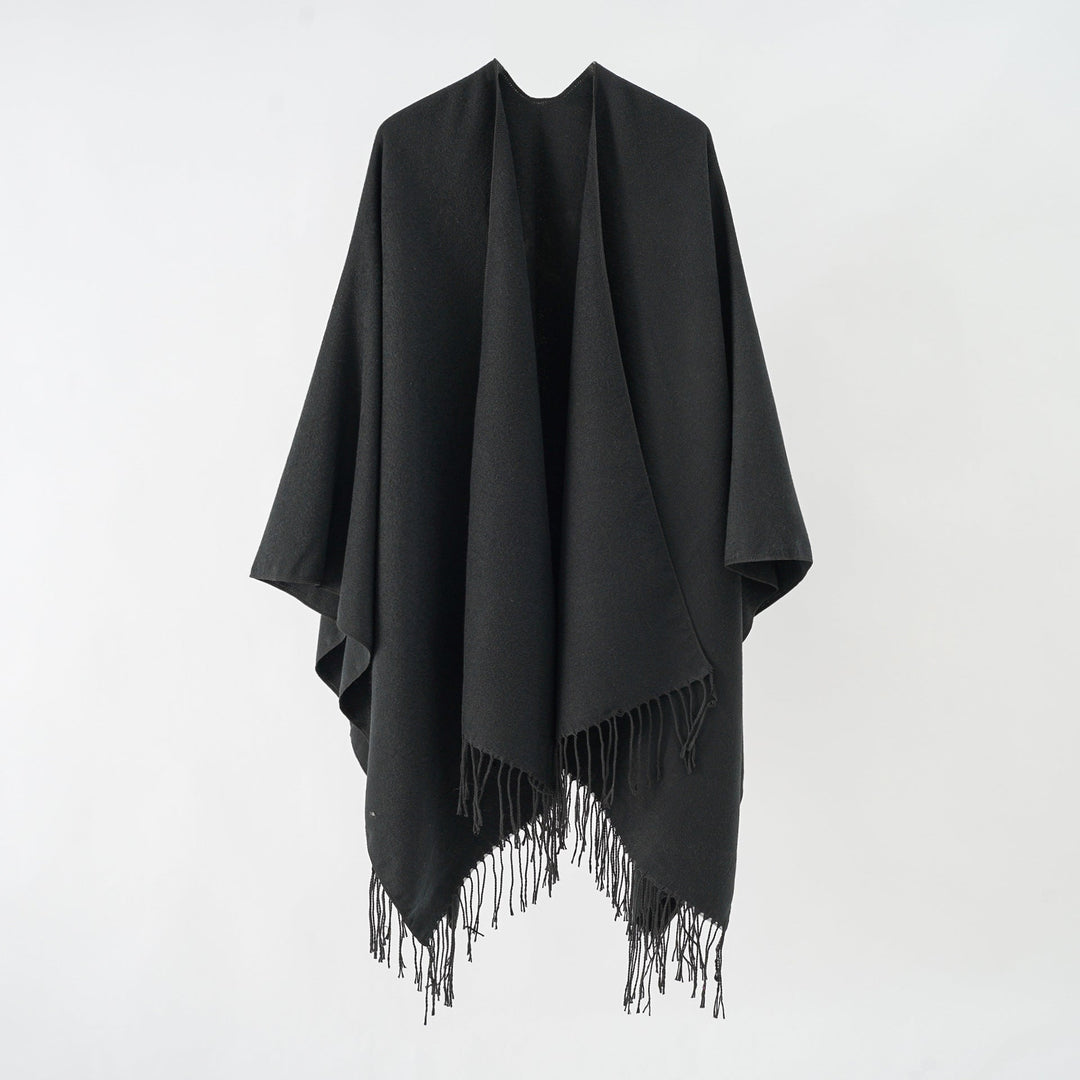 Women's fashionable fringe poncho made of soft material with luxurious drape StylebySassy