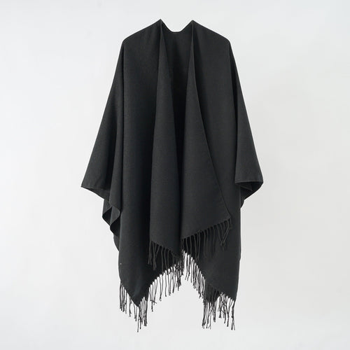 Women's fashionable fringe poncho made of soft material with luxurious drape StylebySassy
