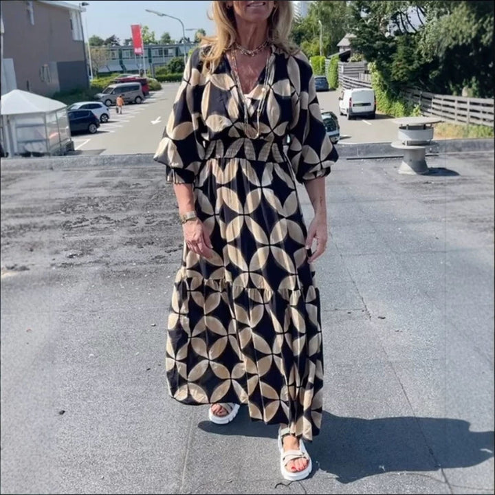 Women's maxi dress with geometric all-over print, smocked waist and ruffled tiers StylebySassy