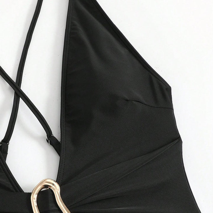 Women's one-piece swimsuit with deep V-neckline and elegant decorative element StylebySassy