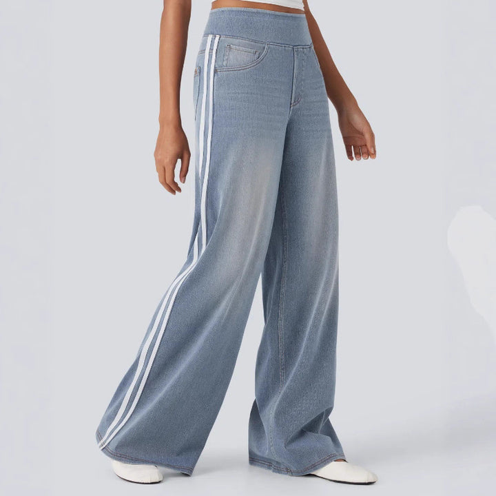 Women's casual wide jogging pants in denim look with elastic comfort waistband, contrasting side stripes and pockets StylebySassy