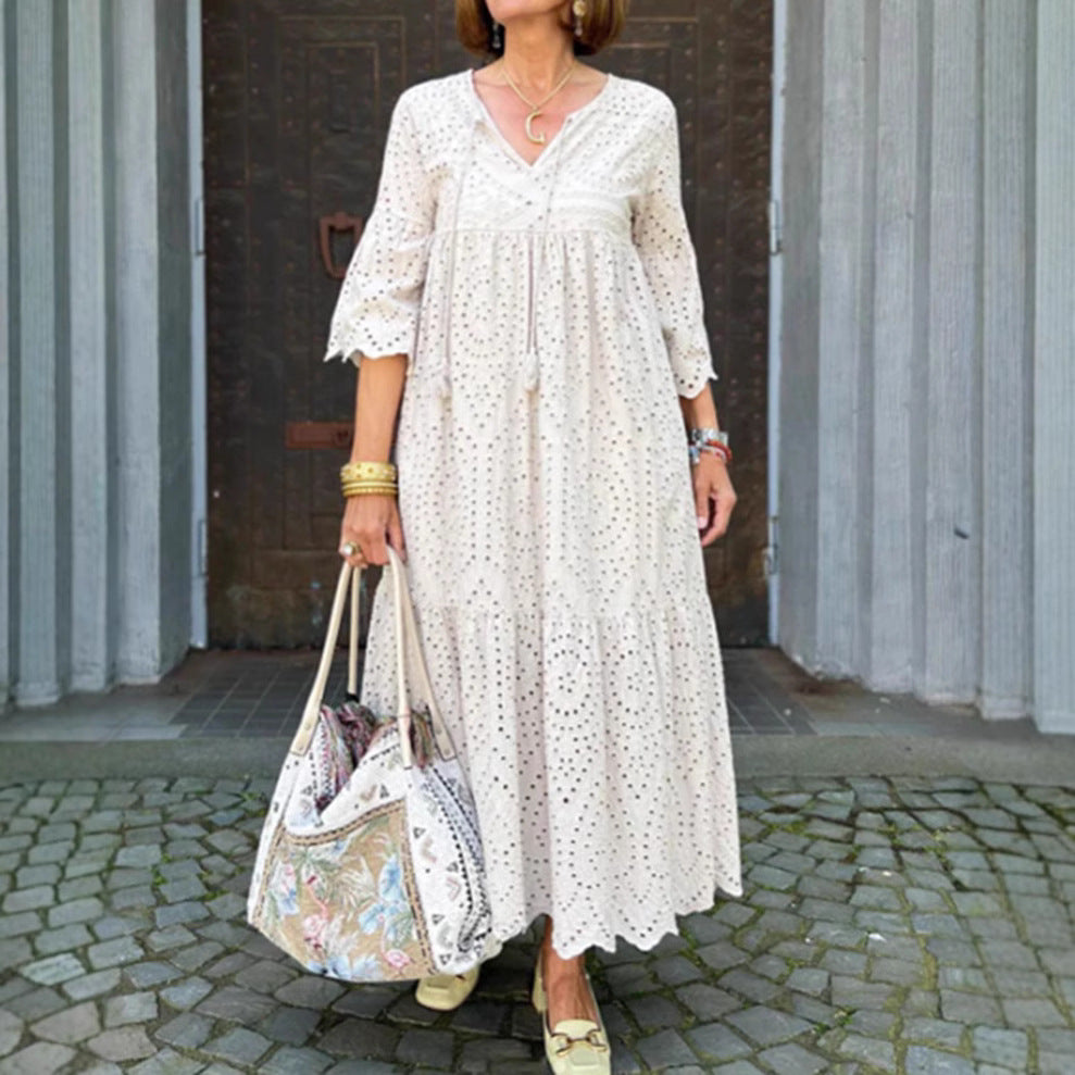 Women's flowing maxi dress with openwork embroidery, V-neck, underbust seam, and ruffled skirt StylebySassy