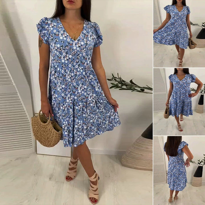 Women’s V-neck dress with gathered waist seam, short flounce sleeves, and tiered skirt StylebySassy
