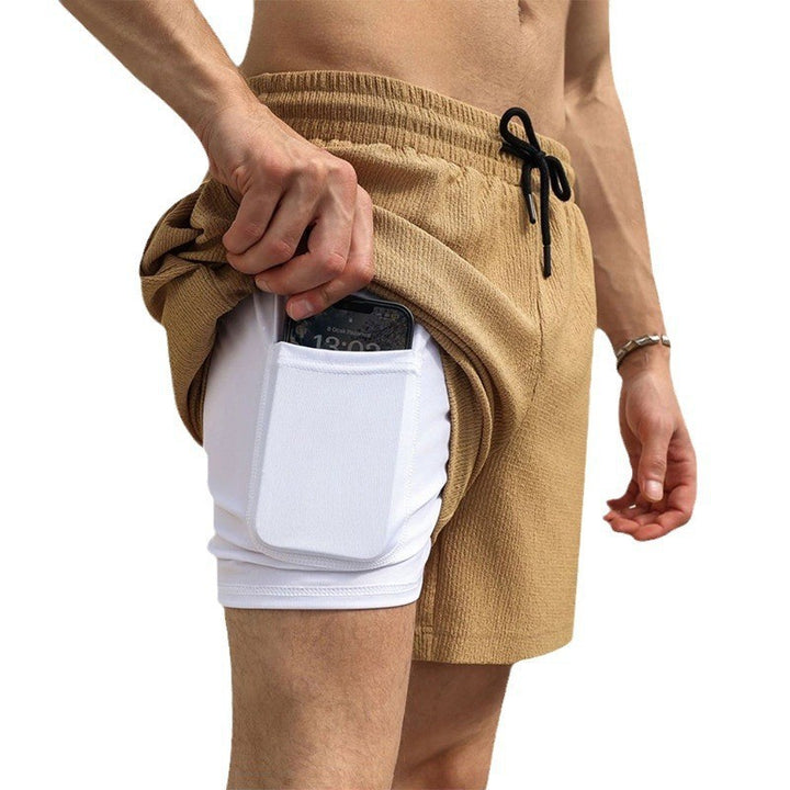Men's two-layer swim shorts with integrated compression inner shorts and hidden cell phone pocket StylebySassy