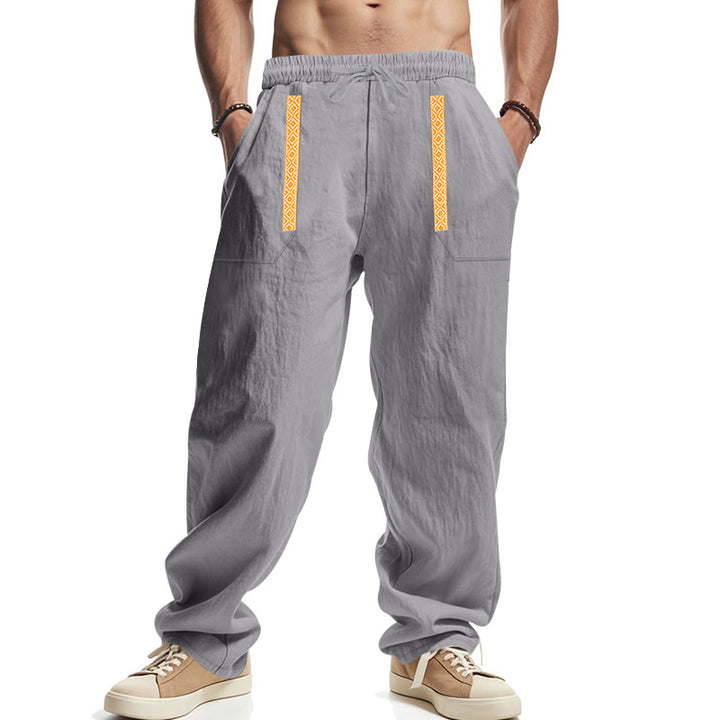 Men's loose-fitting casual pants made of linen blend with elastic waistband, deep side pockets, and ethnic decorative band StylebySassy