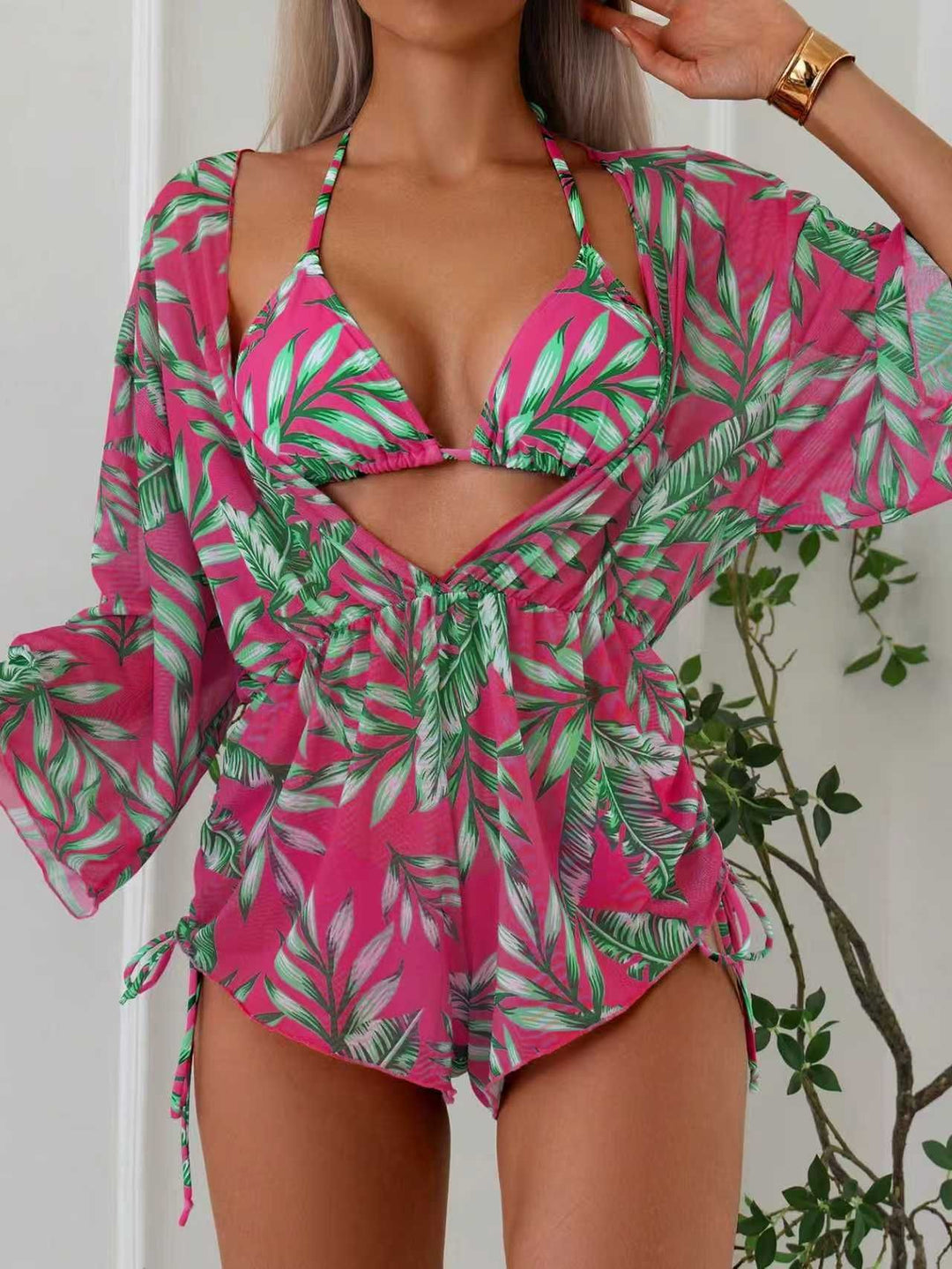 Women's swimsuit with elegant V-neckline and playful palm print StylebySassy