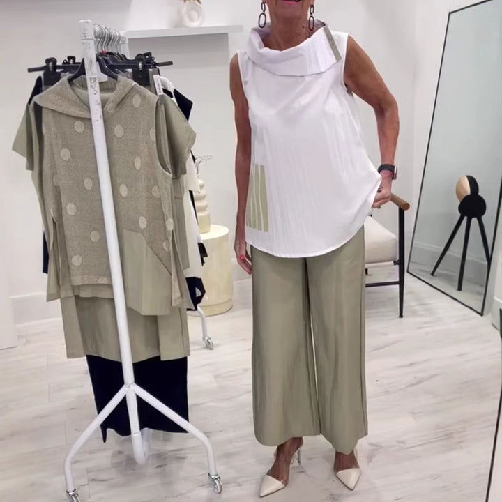 Women's sleeveless blouse top with wide shawl collar, relaxed A-line and side decorative yoke StylebySassy