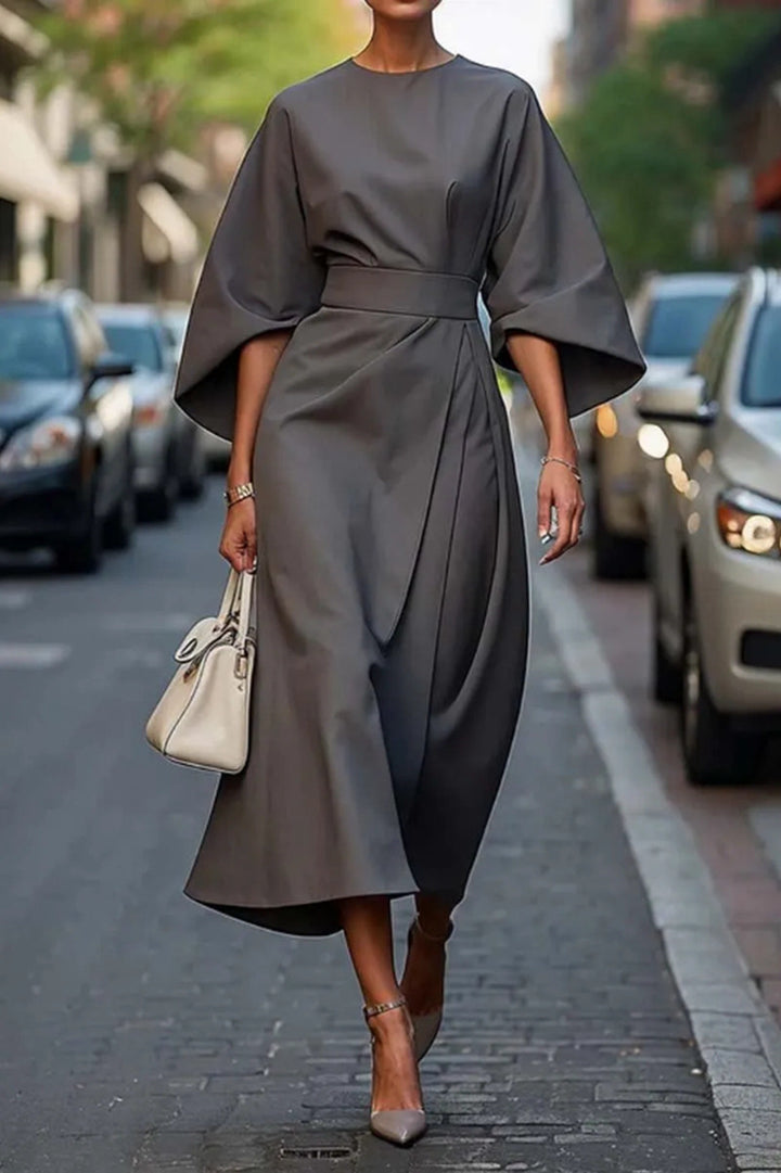 Ladies' elegant midi dress with kimono sleeves, draped wrap look and waist belt StylebySassy