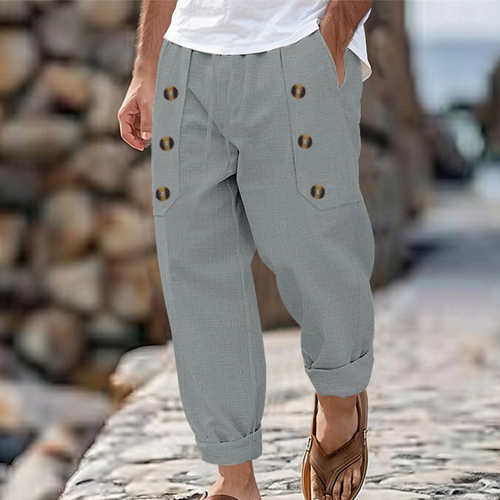 Men's loose linen trousers with decorative button stripes, rolled ankle cuffs, and side pockets StylebySassy