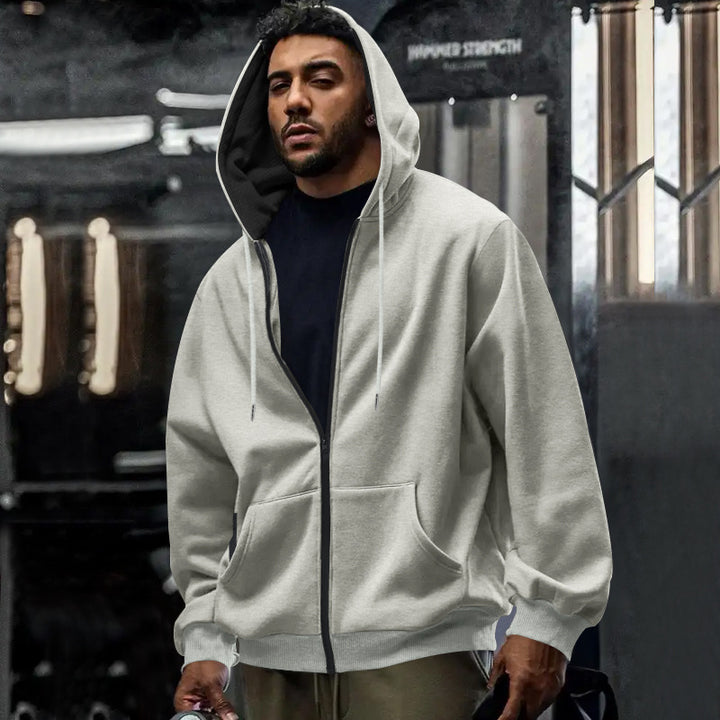 Men's oversized zip-up hoodie with kangaroo pockets and contrasting inner lining StylebySassy