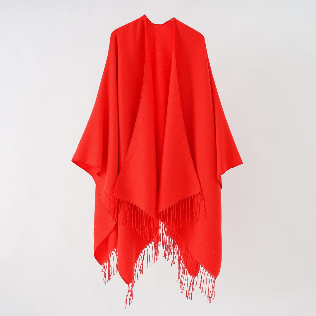 Women's fashionable fringe poncho made of soft material with luxurious drape StylebySassy