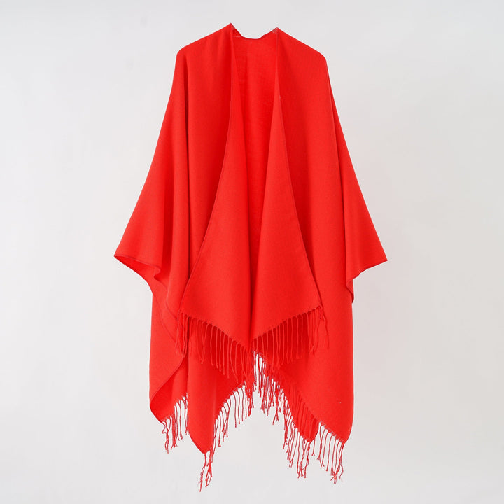 Women's fashionable fringe poncho made of soft material with luxurious drape StylebySassy