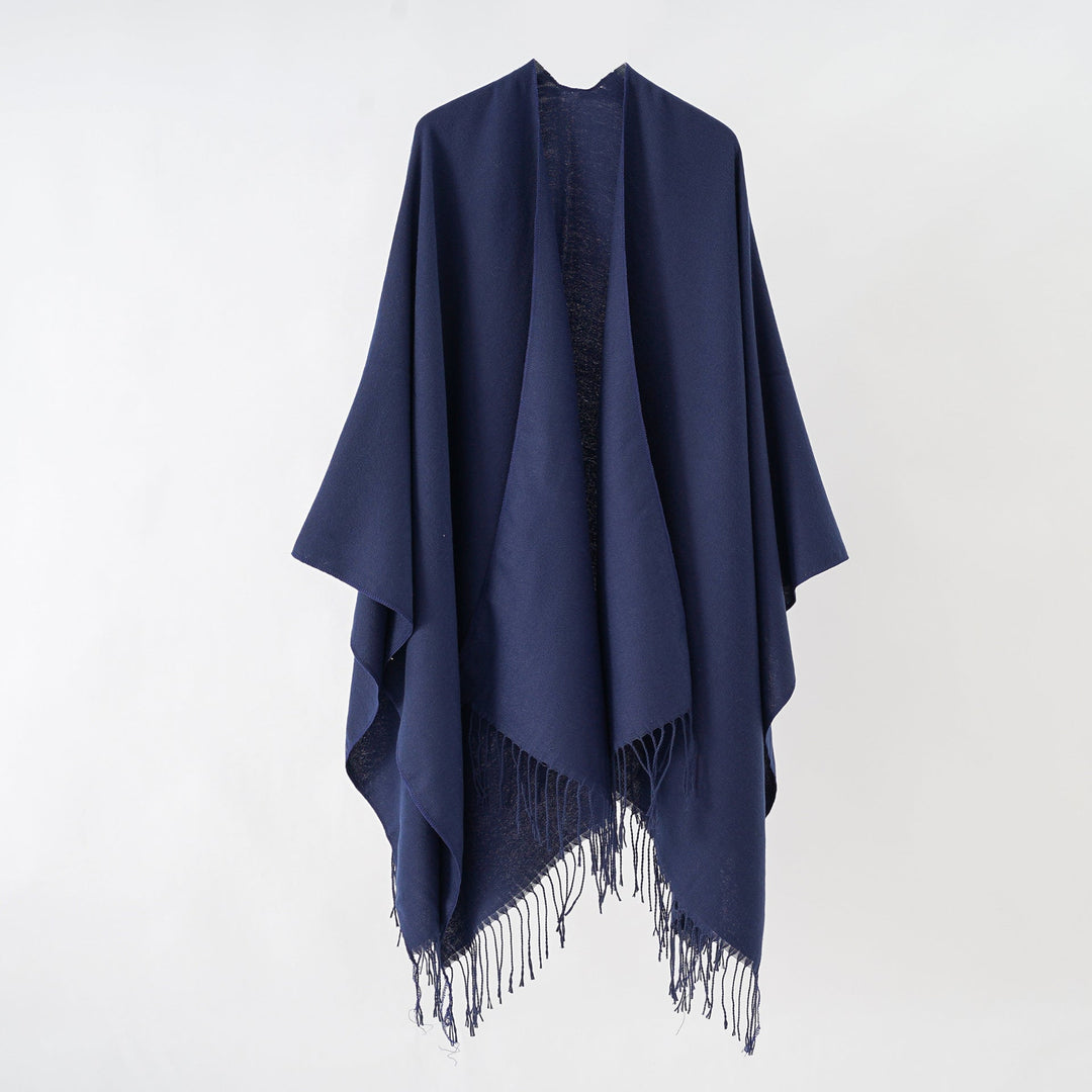 Women's fashionable fringe poncho made of soft material with luxurious drape StylebySassy