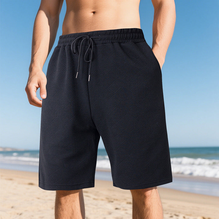 Men's knee-length textured swim shorts with elastic drawstring waistband and side pockets StylebySassy