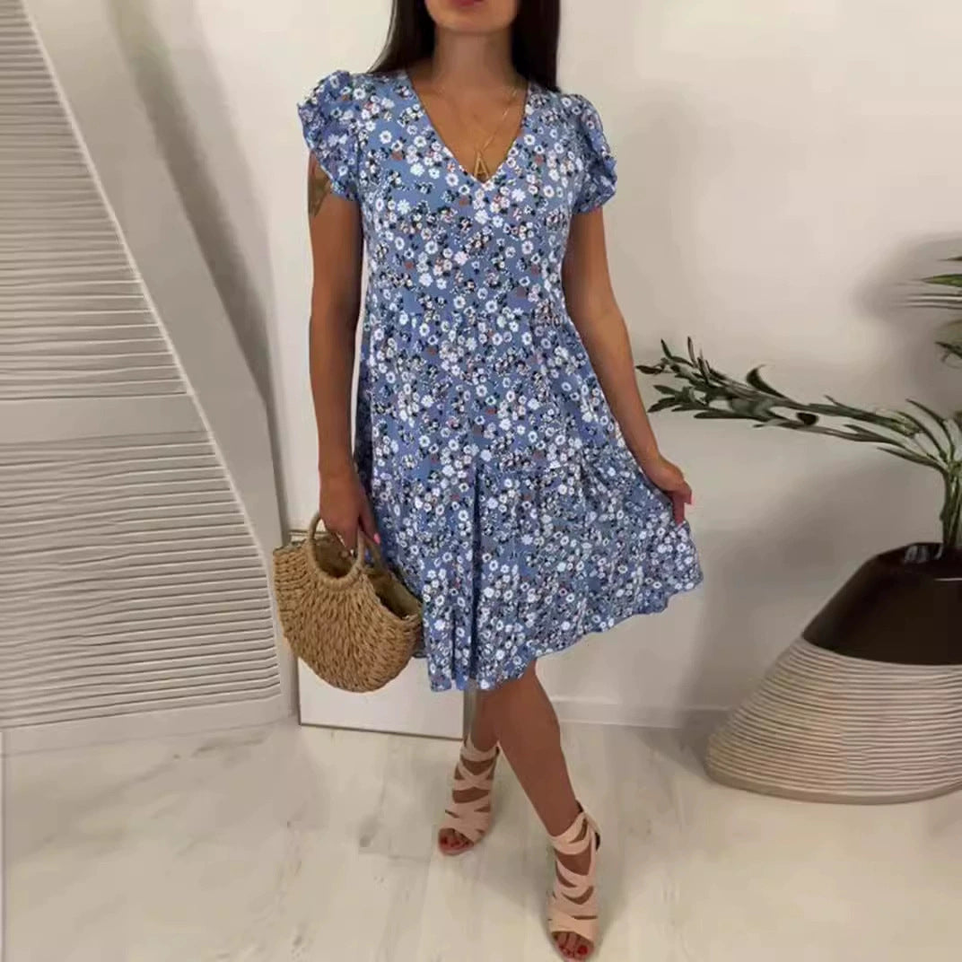 Women’s V-neck dress with gathered waist seam, short flounce sleeves, and tiered skirt StylebySassy