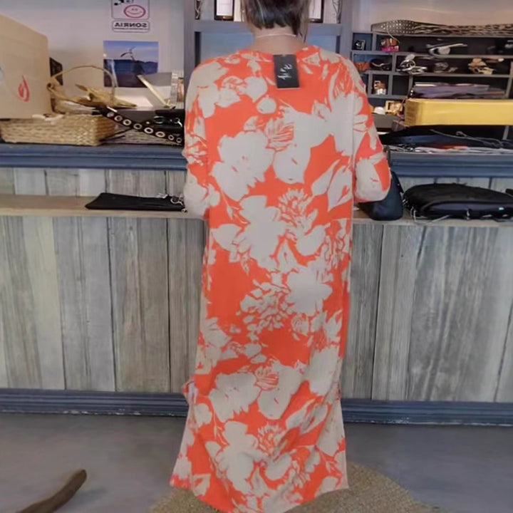 Women’s flowing A-line maxi dress with three-quarter sleeves round neckline side slit and inserted pockets StylebySassy