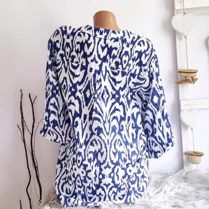 Women nan locker cut tunic blouse with Ikat pattern, V-neck and three-quarter sleeves StylebySassy