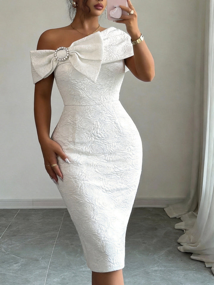 Ladies elegant cocktail dress with asymmetric strap and decorative bow detail StylebySassy