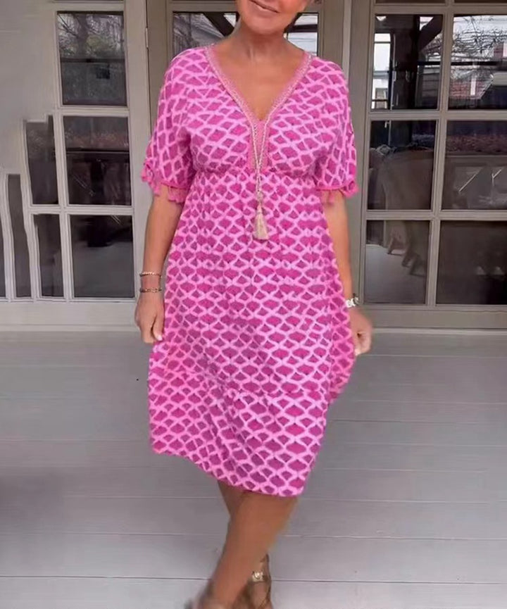 Women's casual V-neck beach dress with tassel tie and ruffle skirt StylebySassy