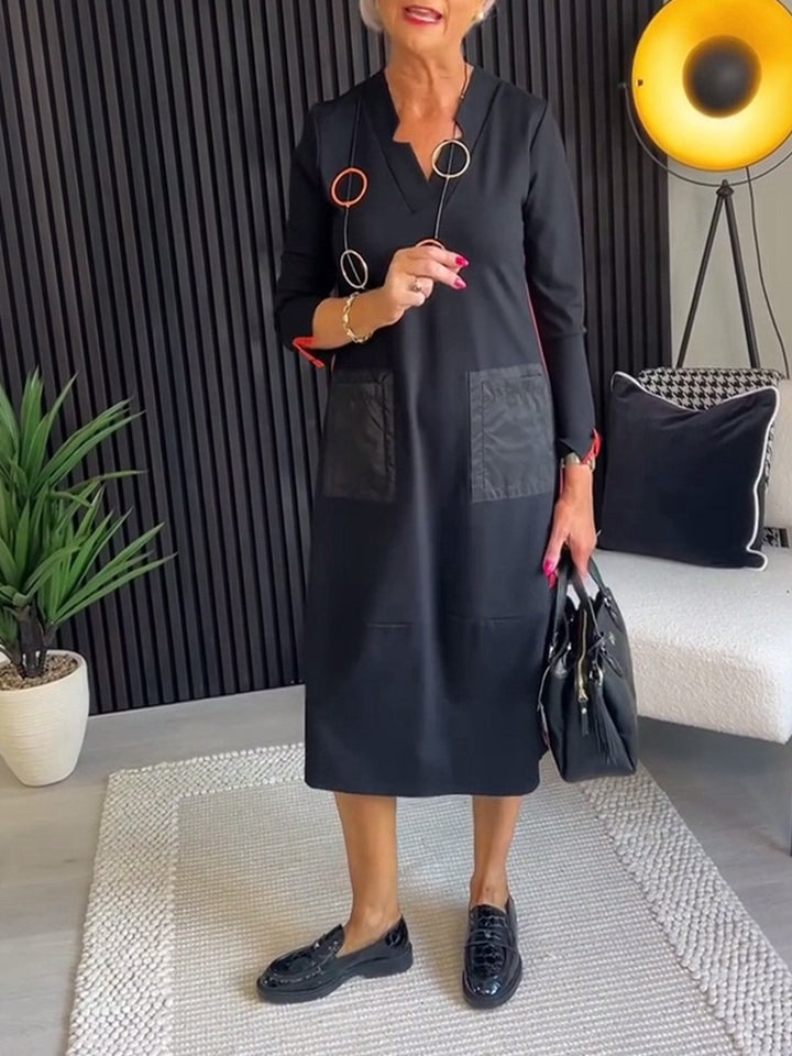 Women's knee-length, loosely falling dress with V-neck contrast pockets made of satin and three-quarter sleeves StylebySassy