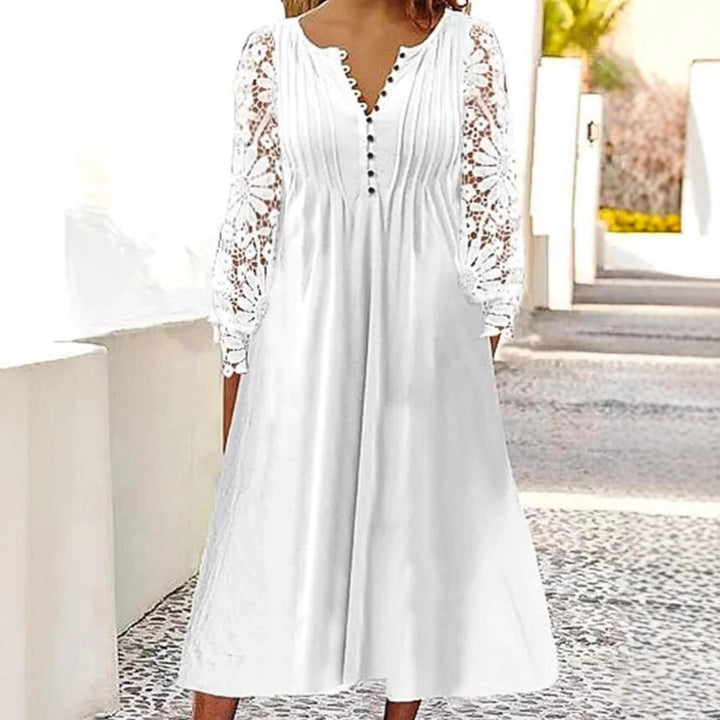 Ladies' knee-length A-line summer dress with crocheted long sleeves, pleated bodice and decorative button placket StylebySassy