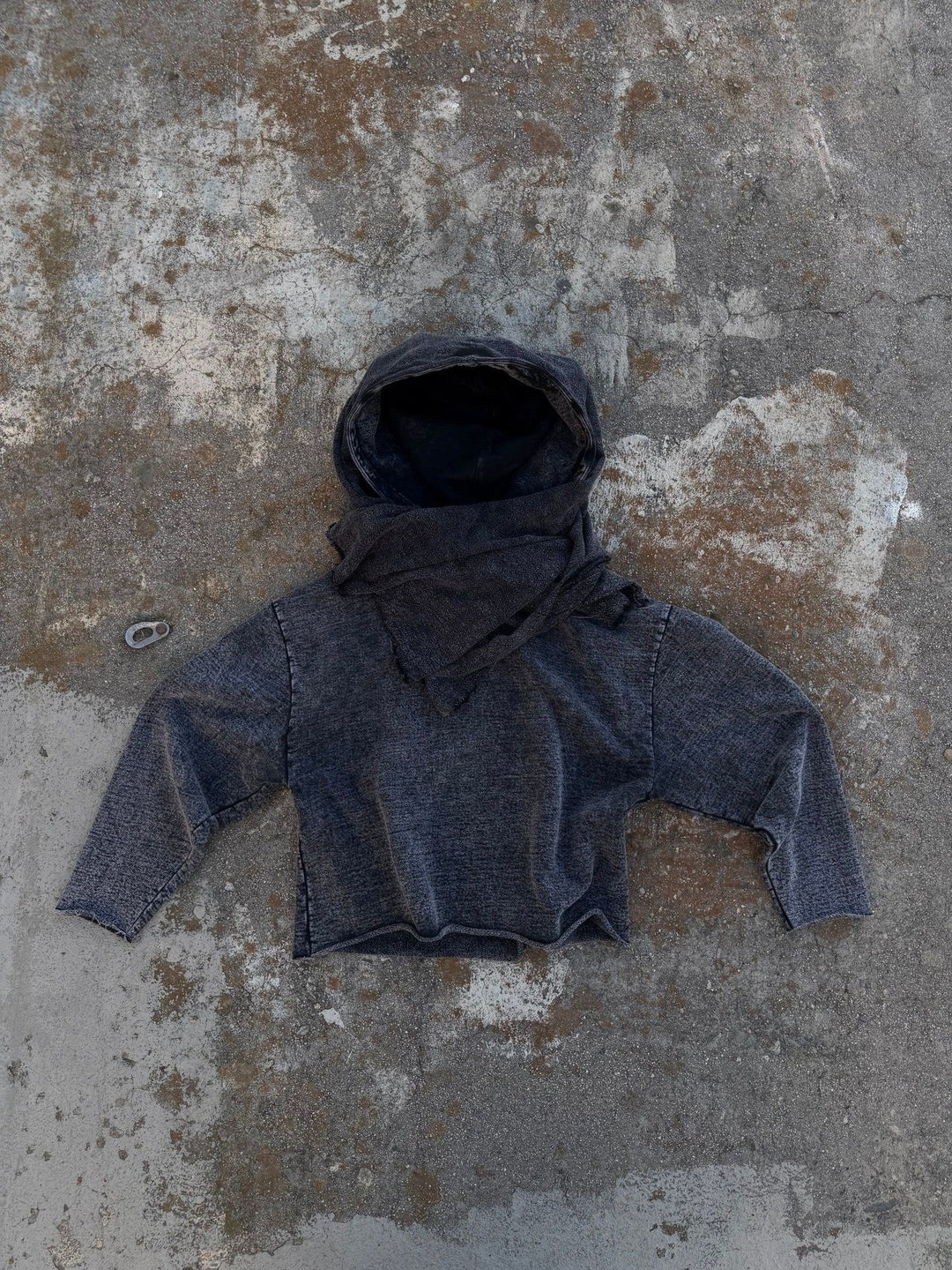 Unisex hooded pullover in usage marks style with attached tube scarf and frayed openings StylebySassy